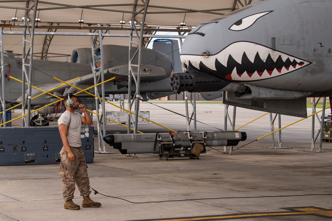 A photo of an Airmen conducting pre-flight check