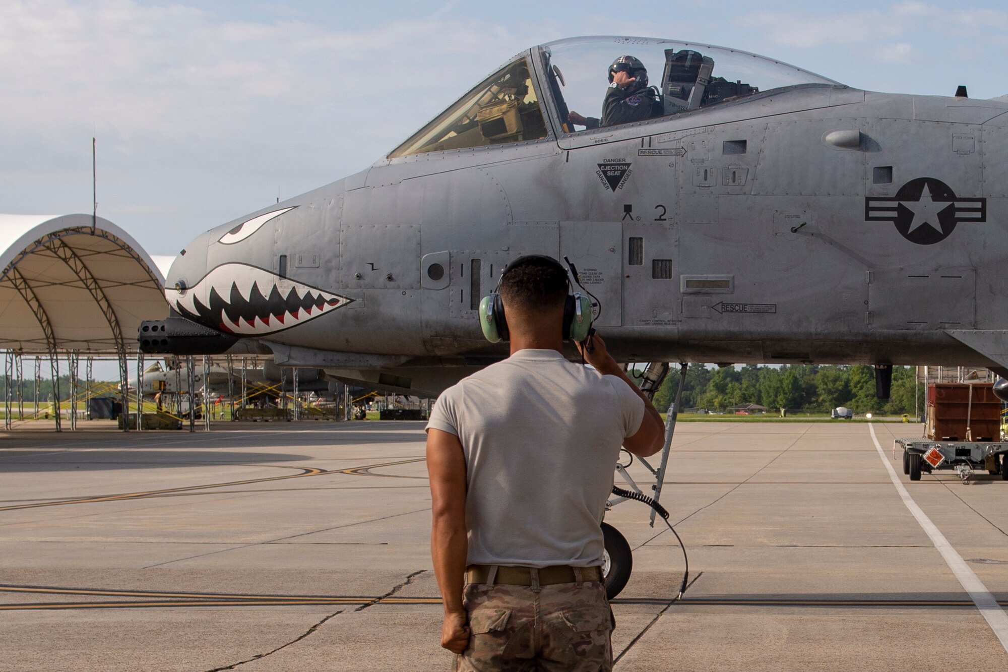 A photo of a crew chief saluting