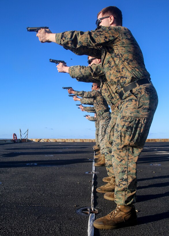 200703-M-MV109-1021  ATLANTIC OCEAN (July 3, 2020) Marines assigned to Battalion Landing Team 2/8, and Combat Logistics Battalion 26, 26th Marine Expeditionary Unit (MEU), fire M9 pistols during a live-fire training range aboard the amphibious transport dock USS New York (LPD 21) July 3, 2020. 26th MEU is conducting operations in U.S. 6th Fleet in support of regional allies and partners, and U.S. national security interests in Europe and Africa.  (U.S. Marine Corps photo by Staff Sgt. Patricia A. Morris/Released)