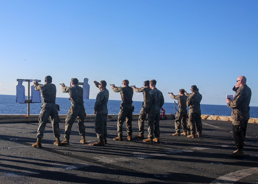 200703-M-MV109-1027  ATLANTIC OCEAN (July 3, 2020) Marines assigned to Battalion Landing Team 2/8, and Combat Logistics Battalion 26, 26th Marine Expeditionary Unit (MEU), fire M9 pistols from the seven-yard line during a live-fire training range aboard the amphibious transport dock USS New York (LPD 21) July 3, 2020. 26th MEU is conducting operations in U.S. 6th Fleet in support of regional allies and partners, and U.S. national security interests in Europe and Africa.  (U.S. Marine Corps photo by Staff Sgt. Patricia A. Morris/Released)