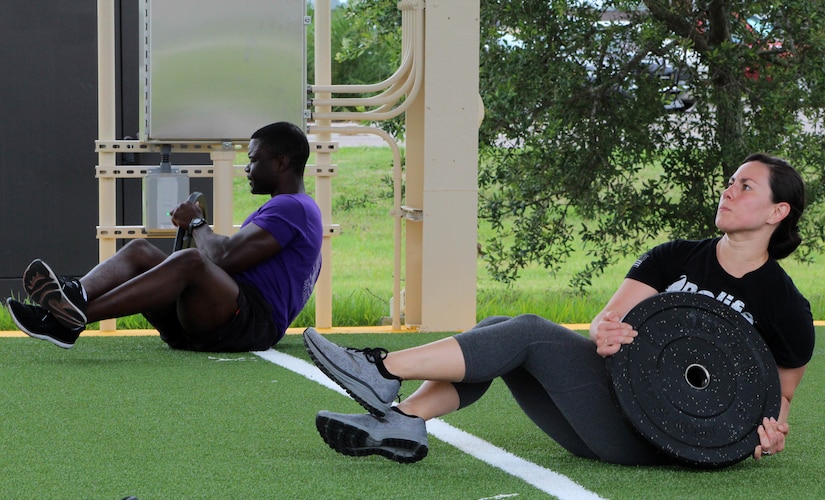 Service members working out.