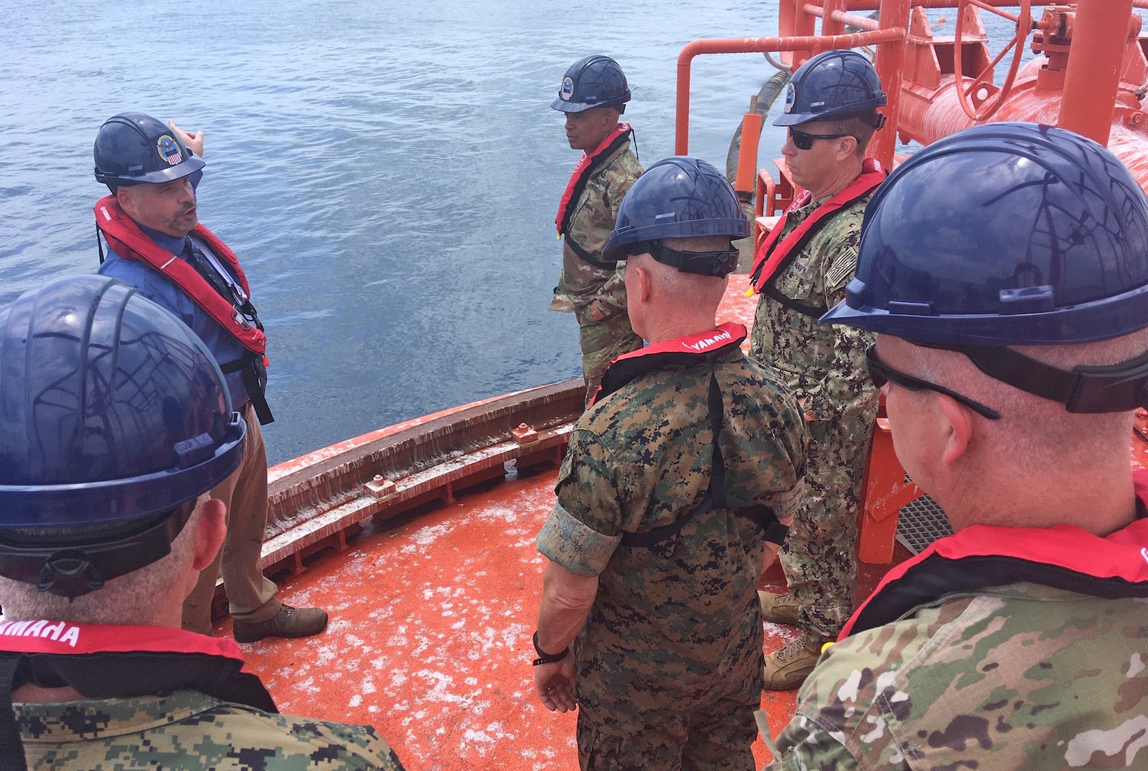 military officers aboard a single point mooring buoy