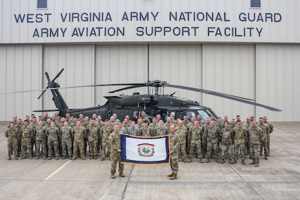 Members of the Charlie Company, 2nd General Support Battalion, 104th Aviation Regiment, (2-104th GASB) pose for a photo at the West Virginia National Guard Army Aviation Support Facility in WIlliamstown, W.Va. More than 60 service members, including pilots, maintainers, flight medics and support staff, will deploy to support aviation operations within the Middle East area of responsibility.