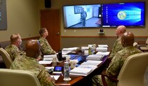 Staff Sgt. Taylor, a satellite network planner, with the Satellite Operations Brigade at Wheeler Army Air Field, Hawaii, U.S. Army Space and Missile Defense Command, virtually addresses the board of six command sergeants major at Peterson Air Force Base, Colorado, during the command’s Best Warrior Competition June 30. (U.S. Army photo by Dottie K. White)
