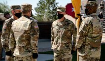 Lt. Gen. Daniel L. Karbler, Col. Eric D. Little, and Col. Brian C. Bolio prepare to pass the unit colors at 1st Space Brigade's Change of Command Ceremony at Fort Carson, Colo., July 1, 2020. U.S. Army Space and Missile Defense Command hosted a brigade change of command ceremony between Col. Eric D. Little, outgoing commander, and Col. Brian C. Bolio, incoming commander, at Fort Carson’s Founders Field, July 1, 2020. (U.S. Army photo by Staff Sgt. Dennis DePrisco)