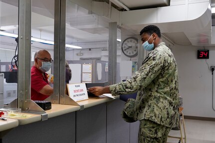 Code 1123 Security Assistant Walter Fung issues a pass to a
visitor at Bldg. 207 Pass & ID. Code 1123 Industrial Security
Branch is dedicated to providing quality professional service,
while ensuring the safety and security of personnel and
critical assets.