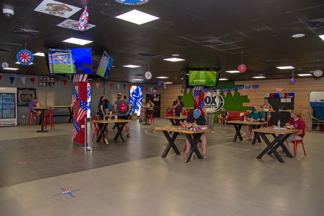 Service members participate in a donated meal event at the Fox Sports Bar, July 4, 2020, Al Udeid Air Base, Qatar. Arby’s, Subway and Pizza hut were some of the establishments that offered free meals to service members to help celebrate the Independence Day holiday.