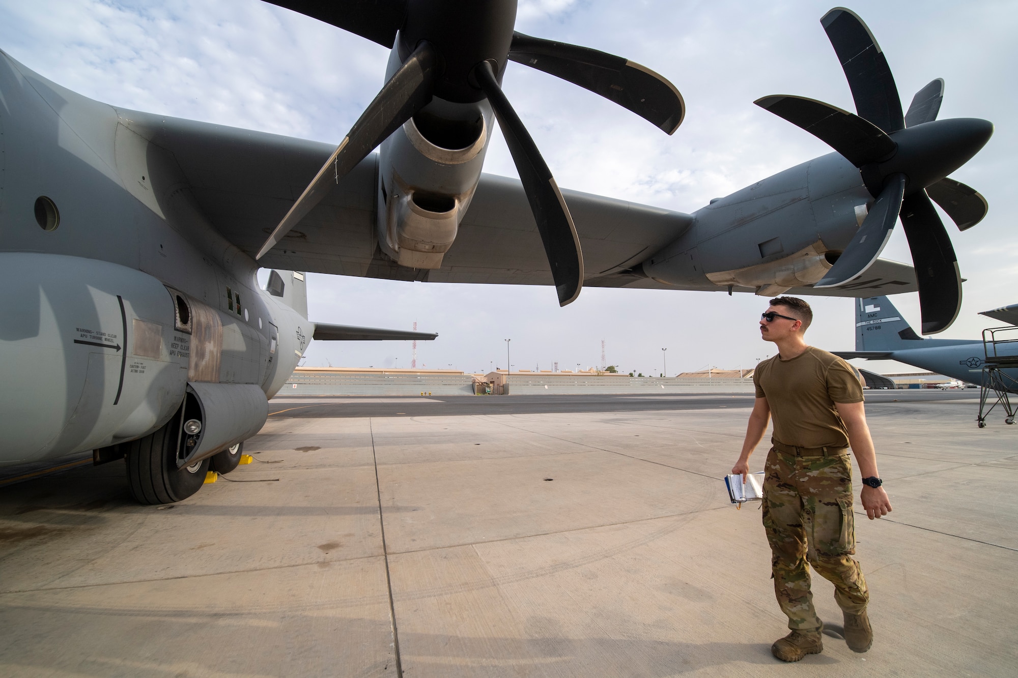 A U.S. Air Force 75th Expeditionary Airlift Squadron (EAS) loadmaster performs a preflight visual inspection on a C-130J Super Hercules at Camp Lemonnier, Djibouti, June 28, 2020. The 75th EAS provides strategic airlift capabilities across the Combined Joint Task Force - Horn of Africa (CJTF-HOA) area of responsibility. (U.S. Air Force photo by Tech. Sgt. Christopher Ruano)