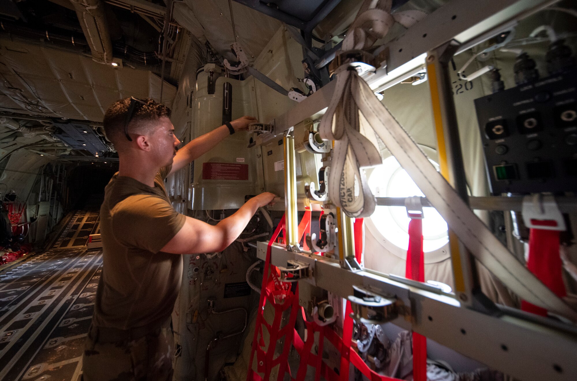 A U.S. Air Force 75th Expeditionary Airlift Squadron (EAS) loadmaster performs a preflight inspection inside a C-130J Super Hercules at Camp Lemonnier, Djibouti, June 28, 2020. The 75th EAS provides strategic airlift capabilities across the Combined Joint Task Force - Horn of Africa (CJTF-HOA) area of responsibility. (U.S. Air Force photo by Tech. Sgt. Christopher Ruano)