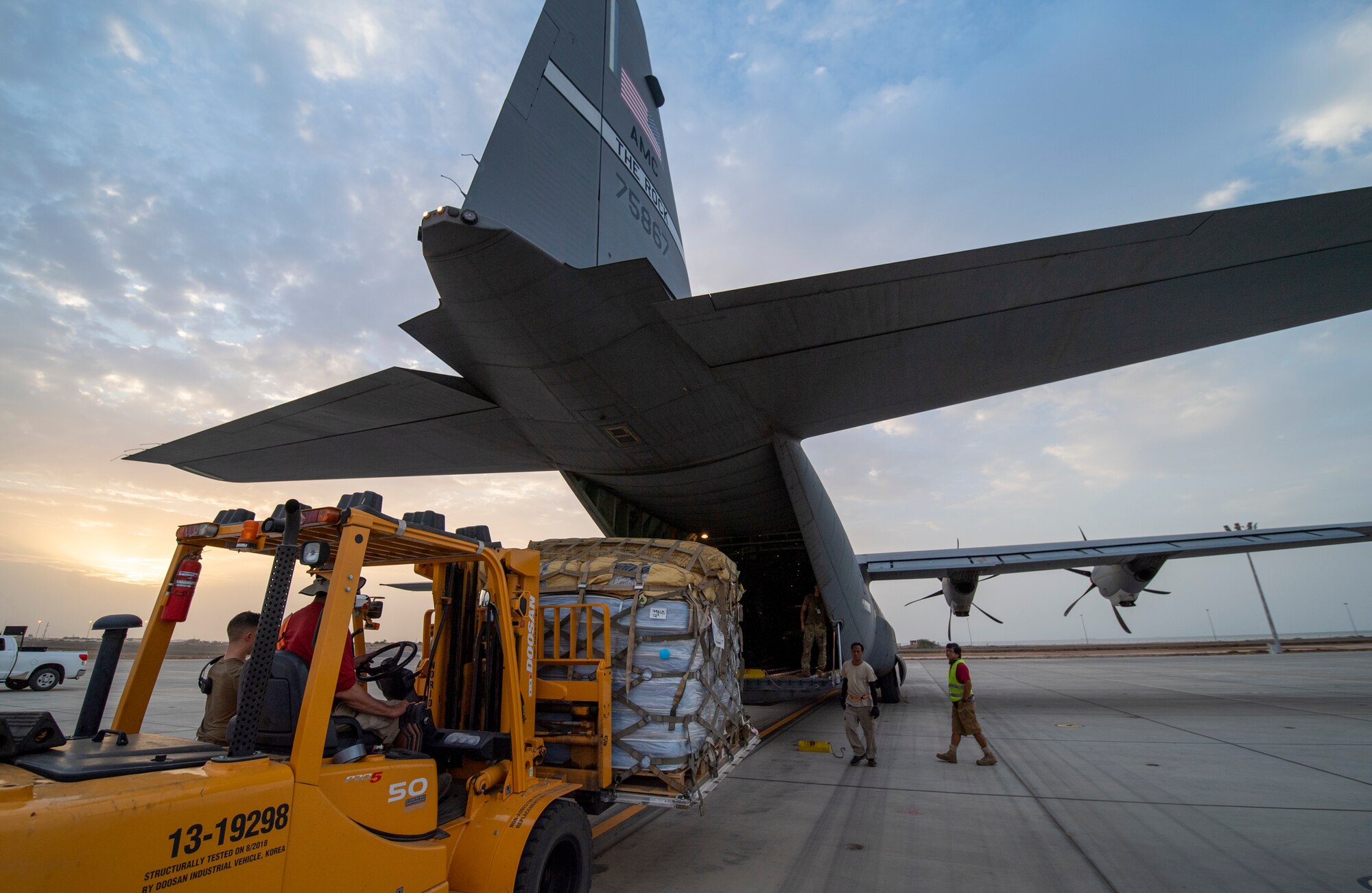 Cargo is loaded onto a U.S. Air Force C-130J Super Hercules assigned to the 75th Expeditionary Airlift Squadron (EAS) at Camp Lemonnier, Djibouti, June 28, 2020. The 75th EAS provides strategic airlift capabilities across the Combined Joint Task Force - Horn of Africa (CJTF-HOA) area of responsibility. (U.S. Air Force photo by Tech. Sgt. Christopher Ruano)