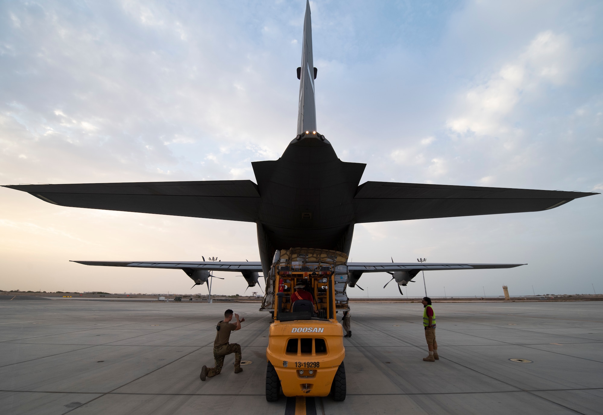 Cargo is loaded onto a U.S. Air Force C-130J Super Hercules assigned to the 75th Expeditionary Airlift Squadron (EAS) at Camp Lemonnier, Djibouti, June 28, 2020. The 75th EAS provides strategic airlift capabilities across the Combined Joint Task Force - Horn of Africa (CJTF-HOA) area of responsibility. (U.S. Air Force photo by Tech. Sgt. Christopher Ruano)
