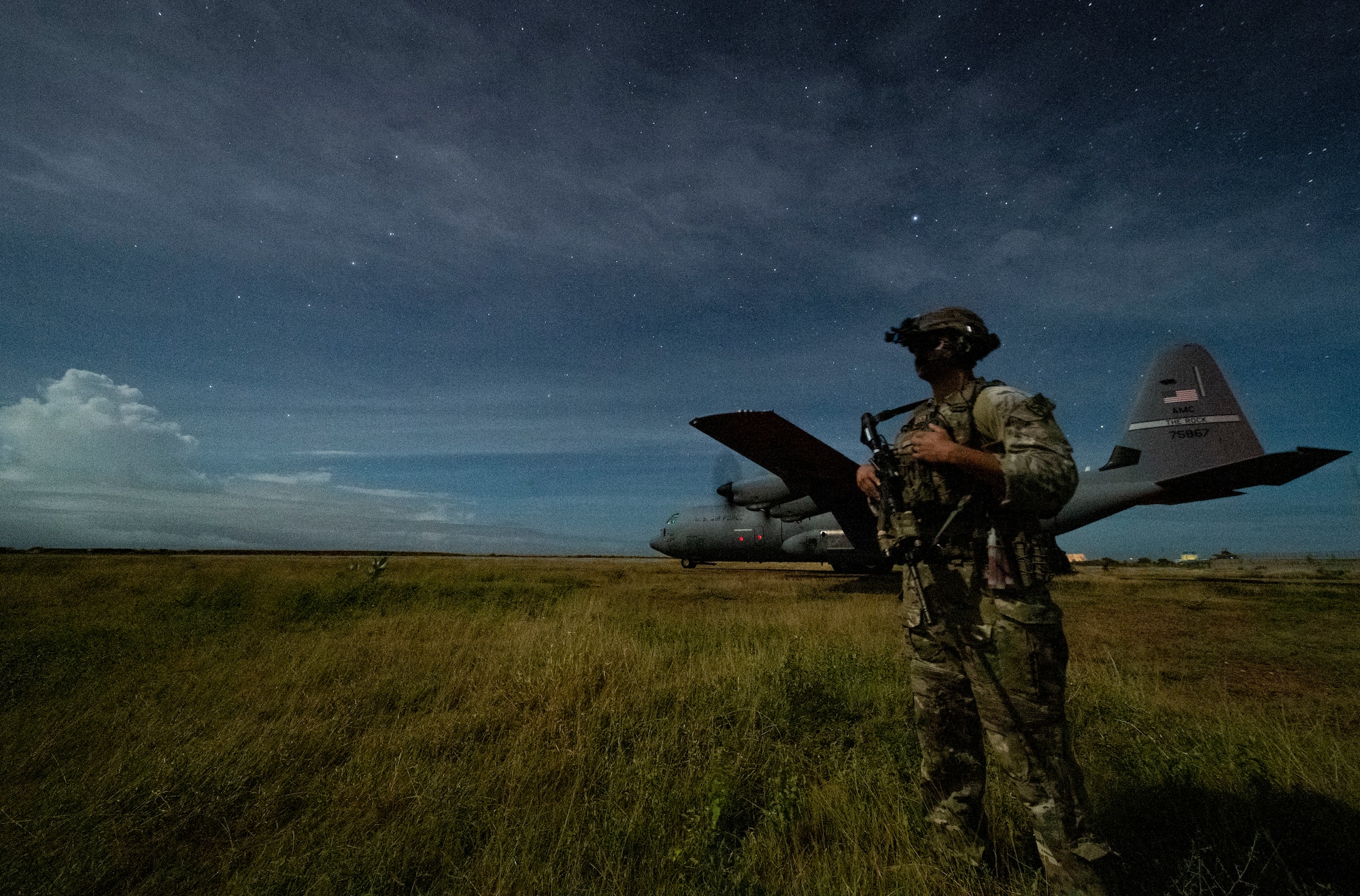 U.S. Army Spc. Kevin Martin, junior sniper, assigned to the 1-186th Infantry Battalion, Task Force Guardian, Combined Joint Task Force – Horn of Africa (CJTF-HOA), provides security for a 75th Expeditionary Airlift Squadron (EAS) C-130J Super Hercules during unloading operations in Somalia, June 28, 2020. Task Force Guardian provides base security and force protection for CJFT-HOA personnel and U.S. partner forces deployed in the region. (U.S. Air Force photo by Tech. Sgt. Christopher Ruano)