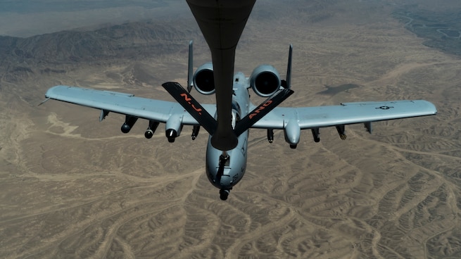 A U.S. Air Force A-10 Thunderbolt II receives fuel from a U.S. Air Force KC-135 Stratotanker assigned to the 340th Expeditionary Air Refueling Squadron over the U.S. Central Command area of responsibility, June 15, 2020. The 340th EARS, deployed with U.S. Air Forces Central Command, is responsible for delivering fuel to U.S. and coalition forces, enabling war-winning airpower, deterrence, and stability to the region. (U.S. Air Force photo by Senior Airman Brandon Cribelar)