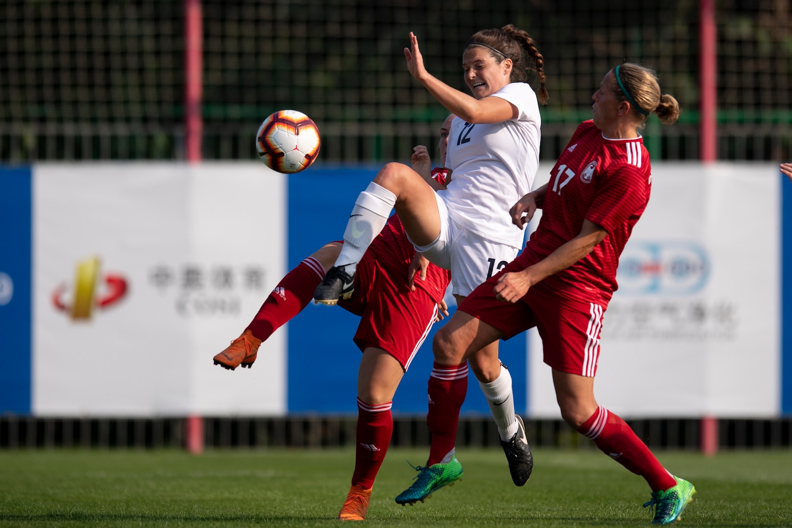 U.S. Air Force 1st Lt. Meredith Reisinger, center, of the U.S. Armed Forces Women’s Soccer Team battles for a ball during a preliminary game with Germany in the 2019 CISM Military World Games in Wuhan, China Oct. 17, 2019. The Council of International Sports for the Military games open Oct. 18, 2019 and close Oct. 28, 2019. (DoD photo by EJ Hersom)