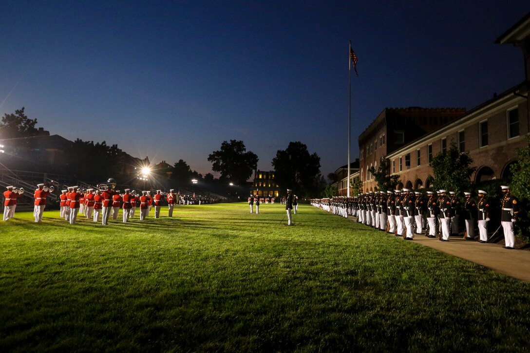 Marines with Marine Barracks Washington perform during a Friday Evening Parade at Marine Barracks Washington, D.C., July 3, 2020. The Honorable Mr. Kenneth Braithwaite, Secretary of the Navy, was the guest of honor, and the 38th Commandant of the Marine Corps, Gen. David H. Berger, was the hosting official. (U.S. Marine Corps Photo by Cpl. James Bourgeois)