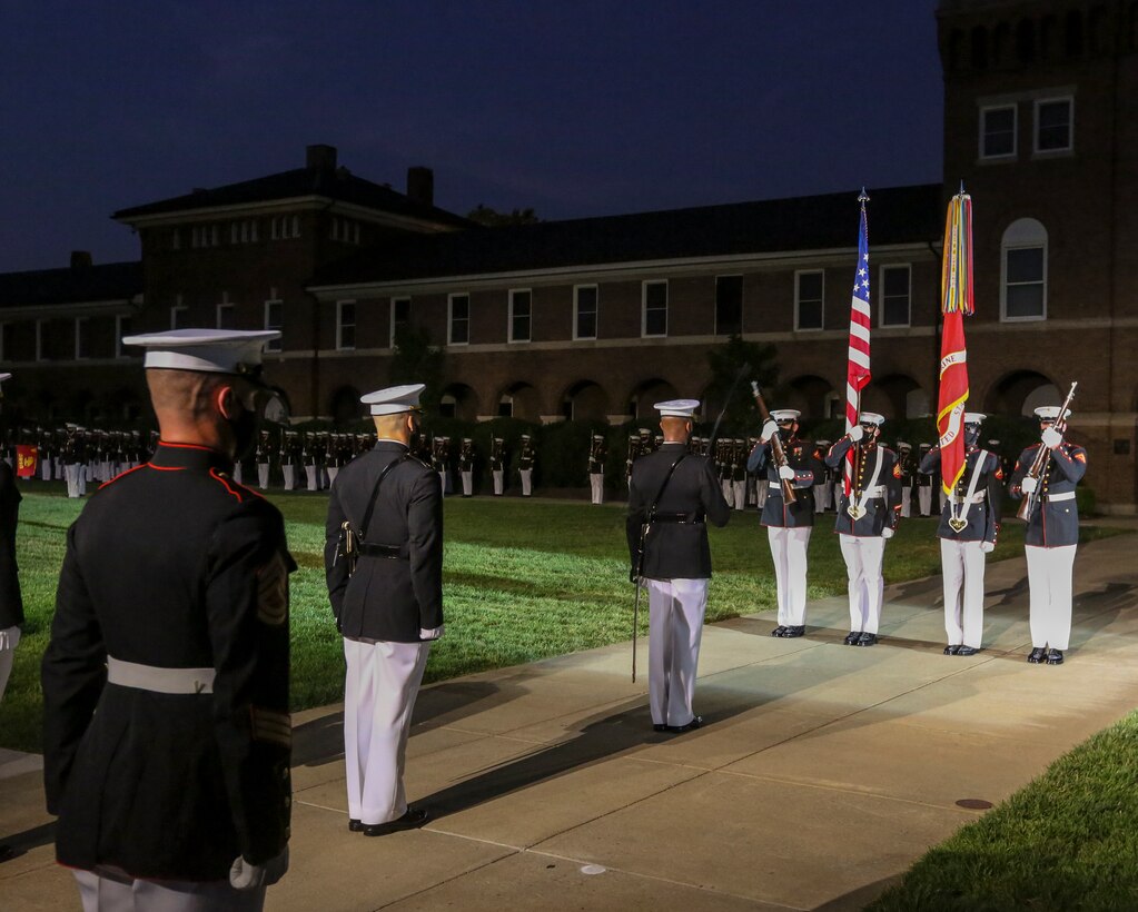 Marines with Marine Barracks Washington perform during a Friday Evening Parade at Marine Barracks Washington, D.C., July 3, 2020. The Honorable Mr. Kenneth Braithwaite, Secretary of the Navy, was the guest of honor, and the 38th Commandant of the Marine Corps, Gen. David H. Berger, was the hosting official. (U.S. Marine Corps Photo by Cpl. James Bourgeois)