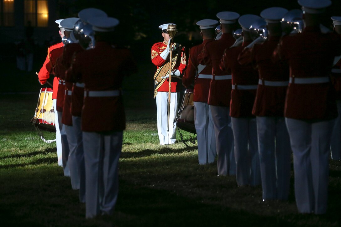 Master Gunnery Sgt. Keith Martinez, drum major, “The Commandant’s Own” U.S. Marine Drum and Bugle Corps, leads the D&B during a Friday Evening Parade at Marine Barracks Washington, D.C., July 3, 2020. The Honorable Mr. Kenneth Braithwaite, Secretary of the Navy, was the guest of honor, and the 38th Commandant of the Marine Corps, Gen. David H. Berger, was the hosting official. (U.S. Marine Corps Photo by Sgt. Robert Knapp)
