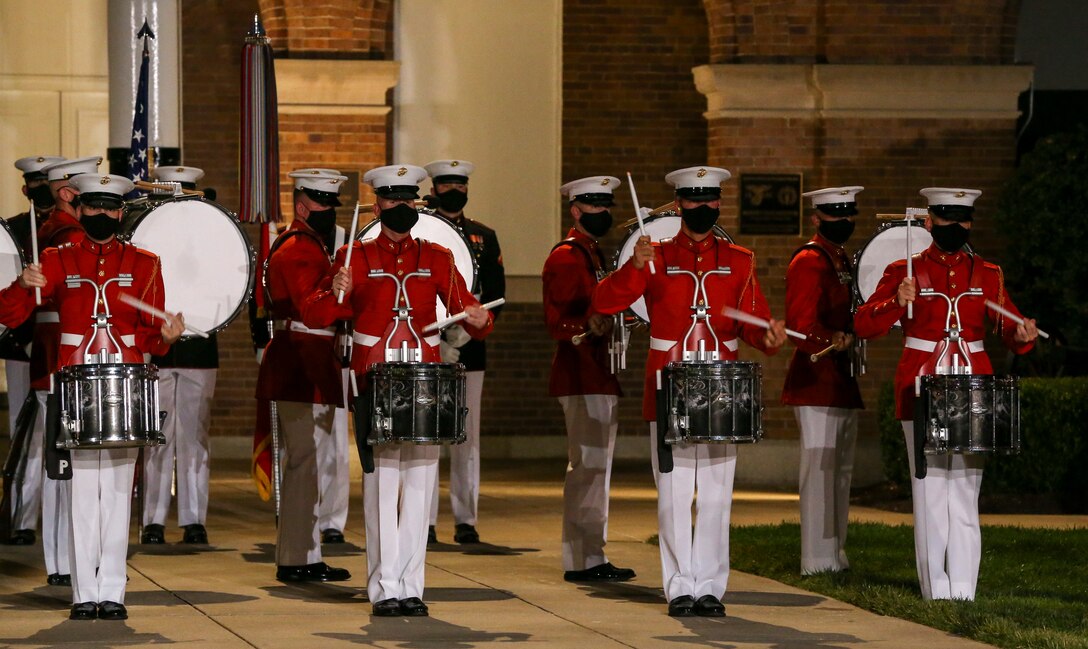 Marines with the drum line, “The Commandant’s Own” U.S. Marine Drum and Bugle Corps, perform during a Friday Evening Parade at Marine Barracks Washington, D.C., July 3, 2020. The Honorable Mr. Kenneth Braithwaite, Secretary of the Navy, was the guest of honor, and the 38th Commandant of the Marine Corps, Gen. David H. Berger, was the hosting official. (U.S. Marine Corps Photo by Sgt. Robert Knapp)