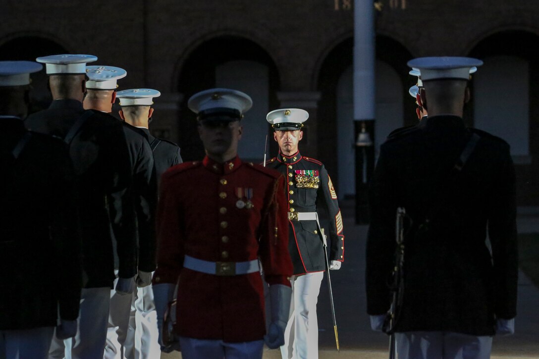 Marines with Marine Barracks Washington perform during a Friday Evening Parade at Marine Barracks Washington, D.C., July 3, 2020. The Honorable Mr. Kenneth Braithwaite, Secretary of the Navy, was the guest of honor, and the 38th Commandant of the Marine Corps, Gen. David H. Berger, was the hosting official. (U.S. Marine Corps Photo by Lance Cpl. Allen Sanders)