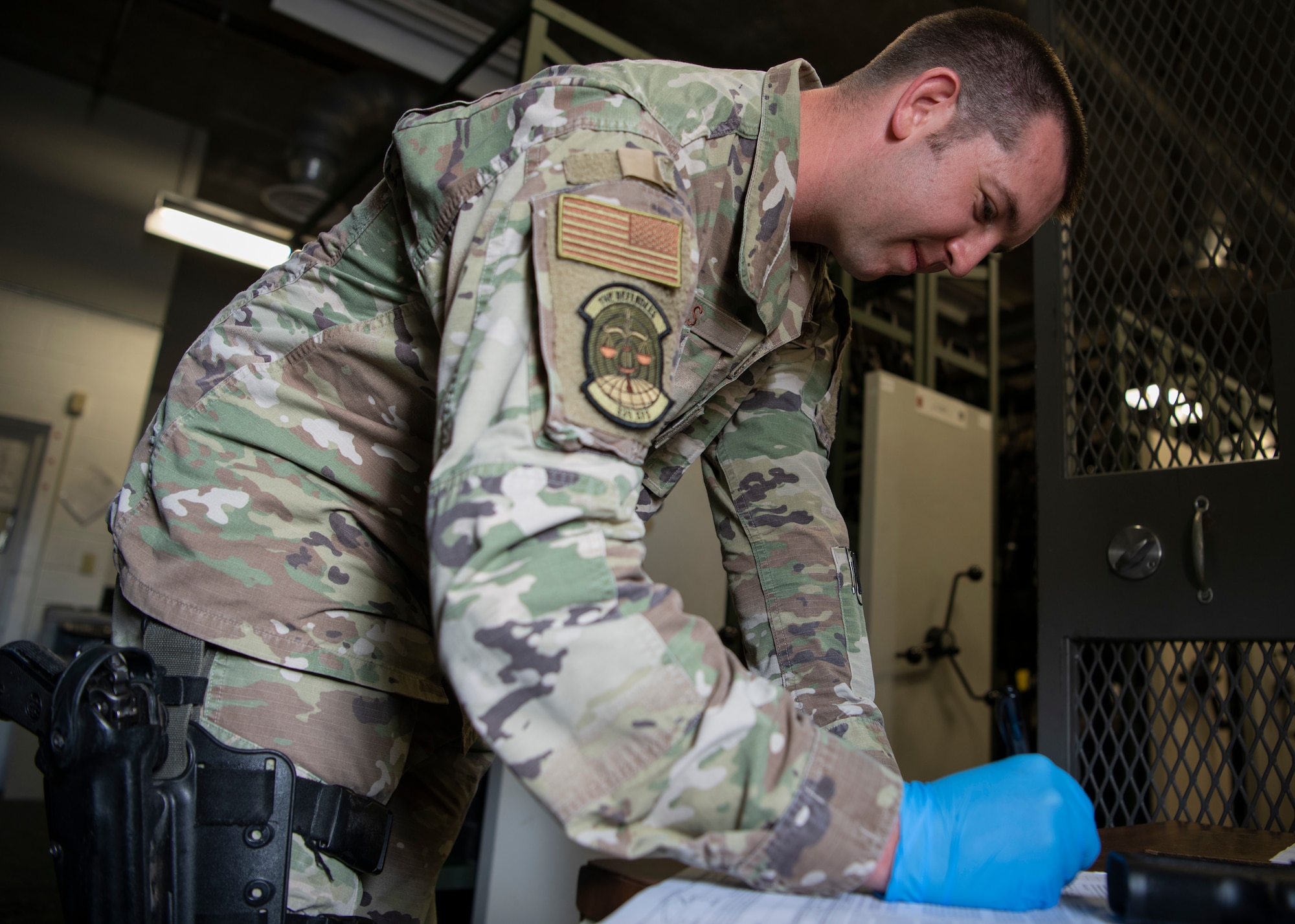 U.S. Air Force Staff Sgt. Kyle Mills, 325th Security Forces Squadron, Combat Arms Training and Maintenance instructor, fills out an Air Force Form 2760 at Tyndall Air Force Base, Florida, July 1, 2020. Effective July, 1, 2020, previously approved forms are no longer accepted. (U.S. Air Force photo by Senior Airman Cheyenne Larkin)