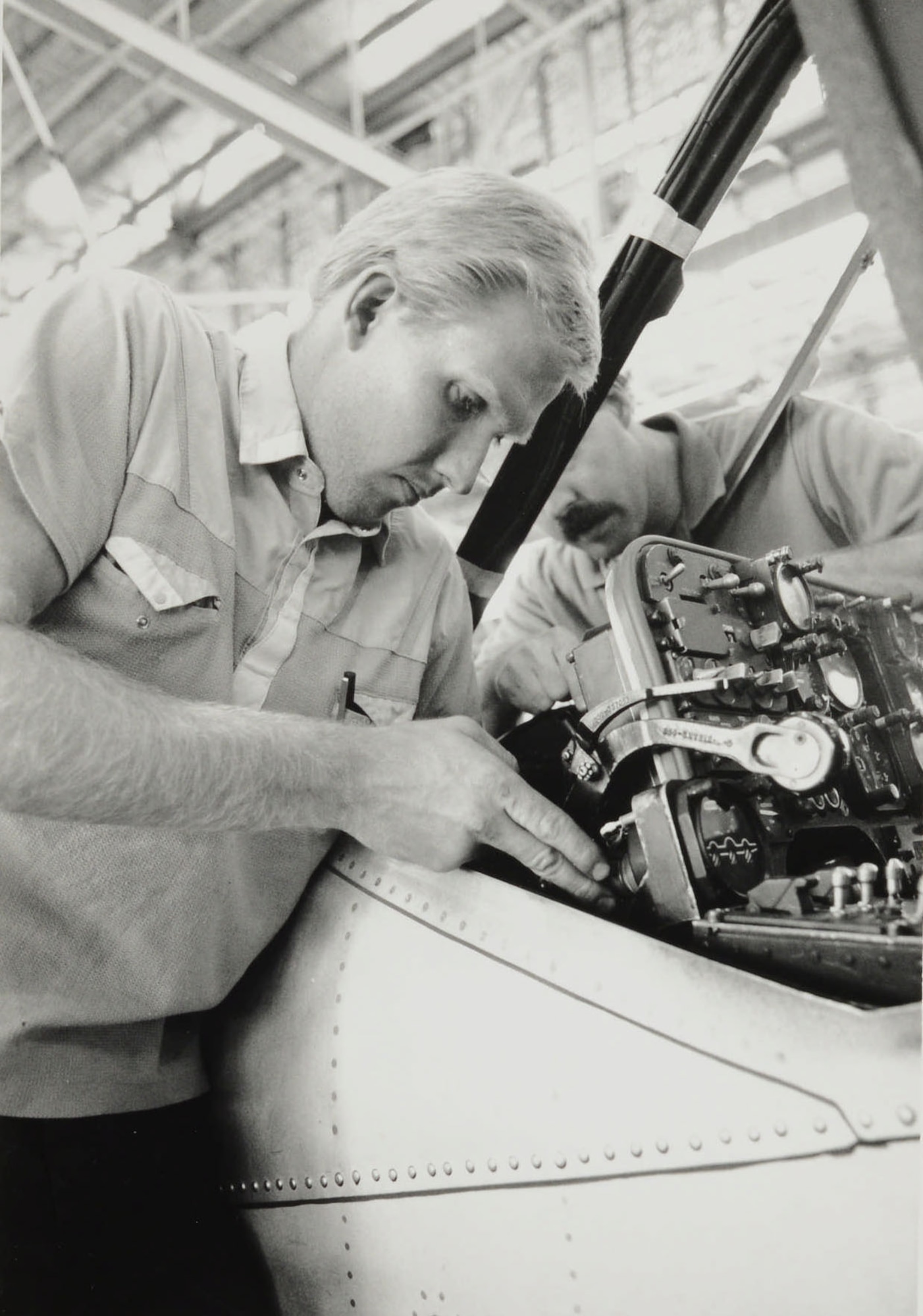 Will Nuttall and Brad Layton working on an OV-10 Bronco.