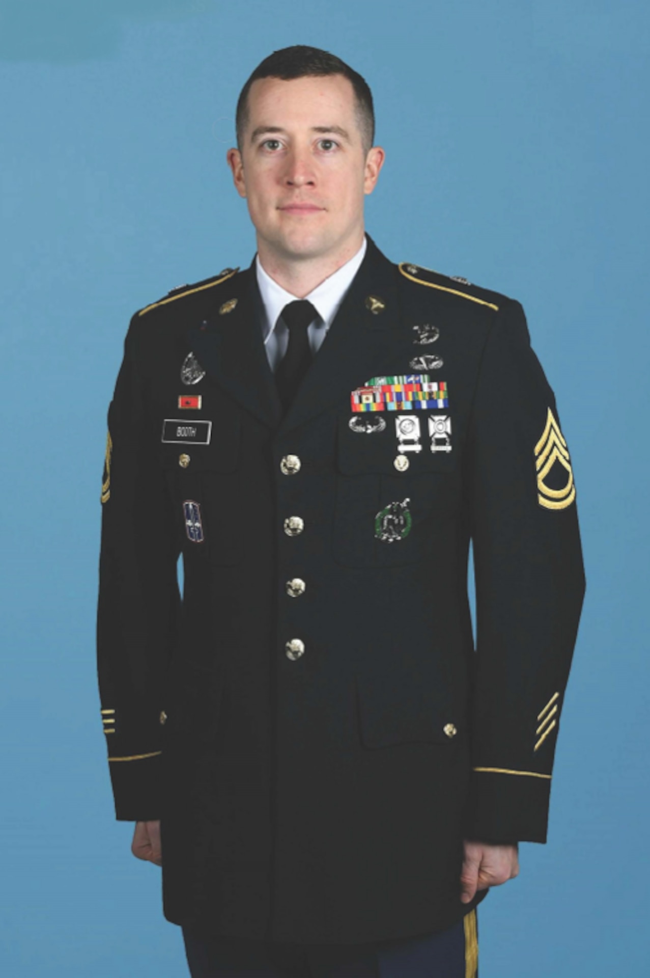 Soldier poses for official Department of the Army service photo in Army Service Uniform.