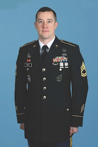 Soldier poses for official Department of the Army service photo in Army Service Uniform.