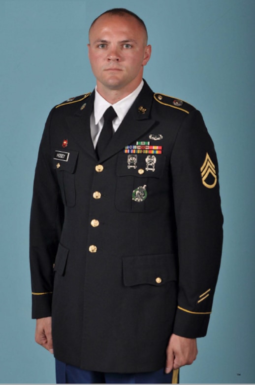 Soldier poses for official Department of the Army service photo in Army Service Uniform.