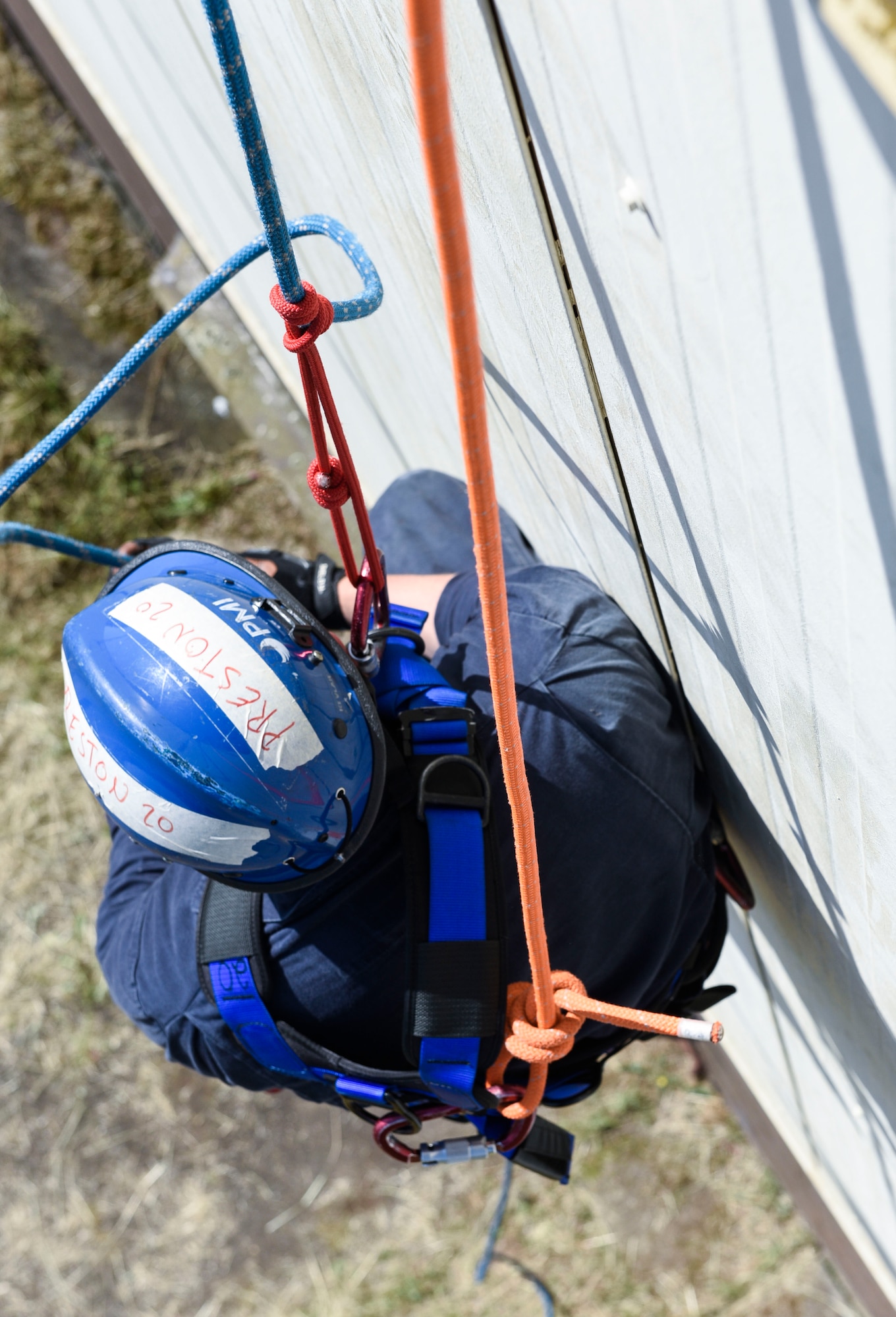 U.S. Air Force Senior Airman Donaven Preston, 52nd Civil Engineer Squadron Fire and Emergency Services firefighter, descends from a building during a Rescue Technician course held at Spangdahlem Air Base, Germany, June 23, 2020. The Rescue Technician course is a three-week course that teaches firefighters how to rescue victims from high and low angles, as well as horizontal and vertical confined spaces. (U.S. Air Force photo by Senior Airman Melody W. Howley)