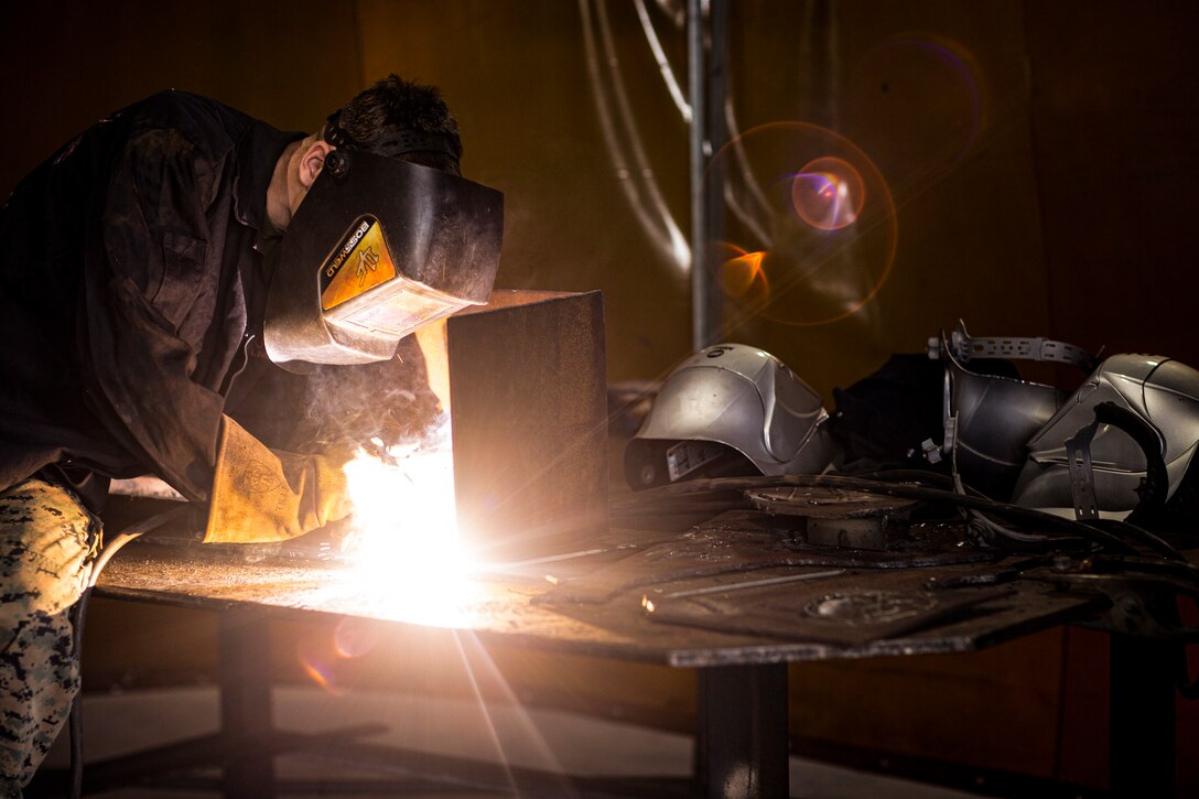 A U.S. Marine practices welding techniques at Robertson Barracks, Australia, July 2.