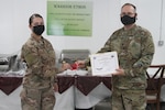 U.S. Army Spc. Taylor Ramsey, from the Colorado National Guard's 117th Space Support Battalion, 1st Space Brigade, U.S. Army Space and Missile Defense Command, receives the Basic Space Badge in CENTCOM's area of responsibility, June 26, 2020. The Space badge certifies a Soldier's competence in their field, after two years of hard work.