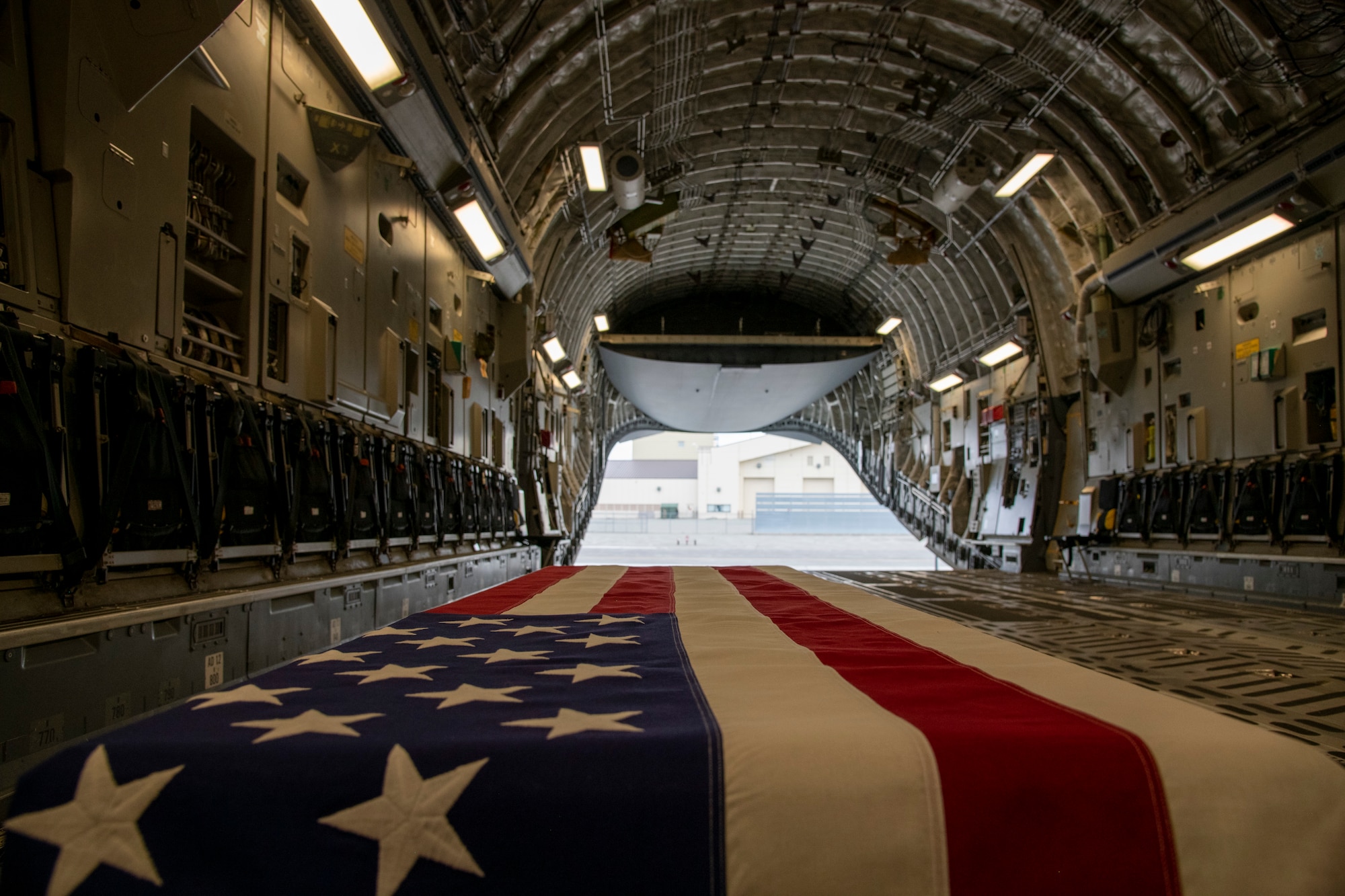 A transfer case awaits transport on a C-17 Globemaster III aircraft at Joint Base Elmendorf-Richardson, Alaska during Operation Colony Glacier, June 29, 2020. Operation Colony Glacier is a recovery effort of remains, personal effects, and aircraft wreckage from a C-124 Globemaster II crash in 1952 on Colony Glacier. This is the first time an Air Mobility Command aircraft has supported this mission. (U.S. Air Force photo by Tech. Sgt. Esteban Esquivel)