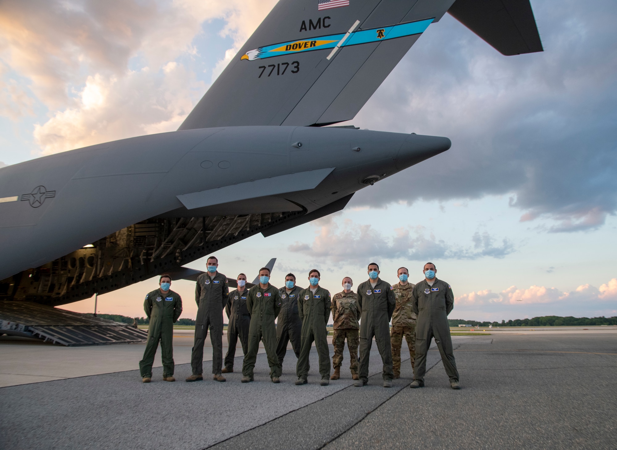 Airmen of the 3rd Airlift Squadron and 736th Aircraft Maintenance Squadron pose for a photo at the conclusion of Operation Colony Glacier June 29, 2020, at Dover Air Force Base, Delaware. The crew flew from Dover AFB to Joint Base Elmendorf-Richardson, Alaska, to return remains found during Operation Colony Glacier 2020. (U.S. Air Force photo by Tech. Sgt. Esteban Esquivel)