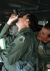 Colonel David Goldfein, 49th Fighter Wing commander, and Major Patrick Adams, 7th Fighter Squadron, check the F-117's Nighthawk pass bottle before flight on September 14, 2006, Holloman Air Force Base, N.M. The pass bottle is used to start the F- 117's auxiliary power unit.
