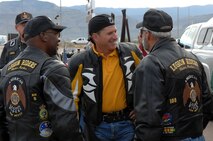 Brig. Gen. David Goldfein, 49th Fighter Wing commander, talks with Mr. Ed "Wishbone" Summerall, American Legion Riders chapter 8 president, and other members of the motorcycle club before taking off to Brooke Army Medical Center, San Antonio, Texas. The riders brought comfort and personal items and monetary donations to the center for Operation Wounded Warrior. (U.S. Air Force photo by Airman 1st Class John Strong)