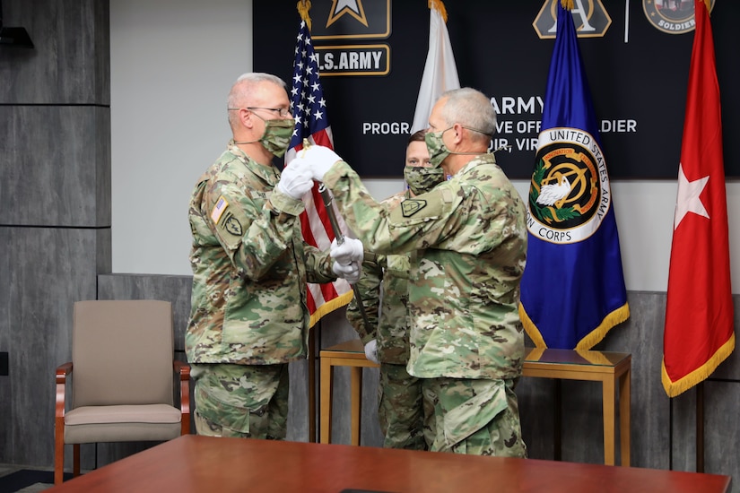 Sgt. Maj. Vern Daley accepts the Non-commissioned Officer sword from Brig. Gen. Anthony Potts, Program Executive Officer (PEO) Soldier to become the new Program Executive Office (PEO) Soldier’s Sergeant Major during the Assumption of Responsibility ceremony at Fort Belvoir, Va on 19 June 2020.