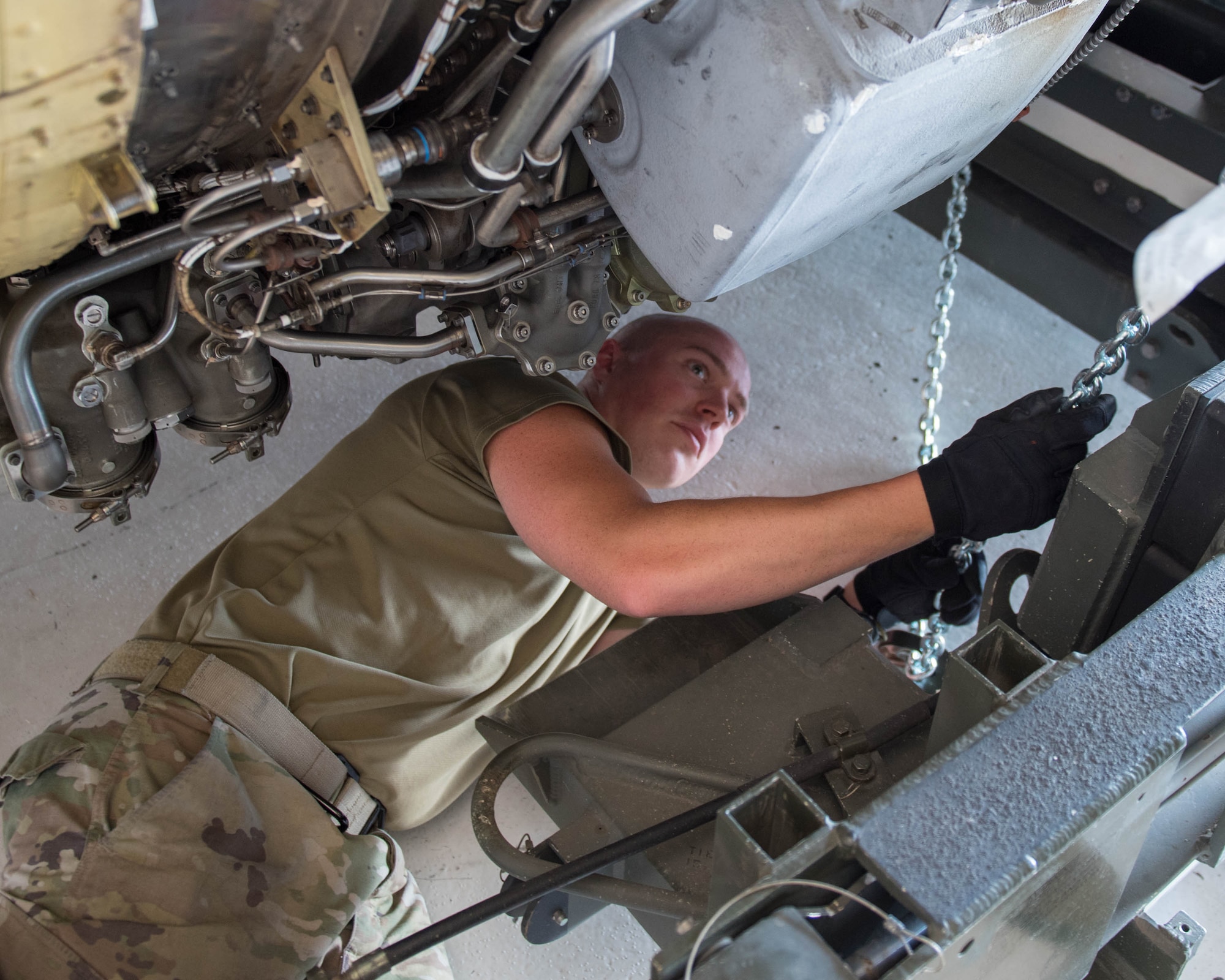 914th maintenance member installs engine