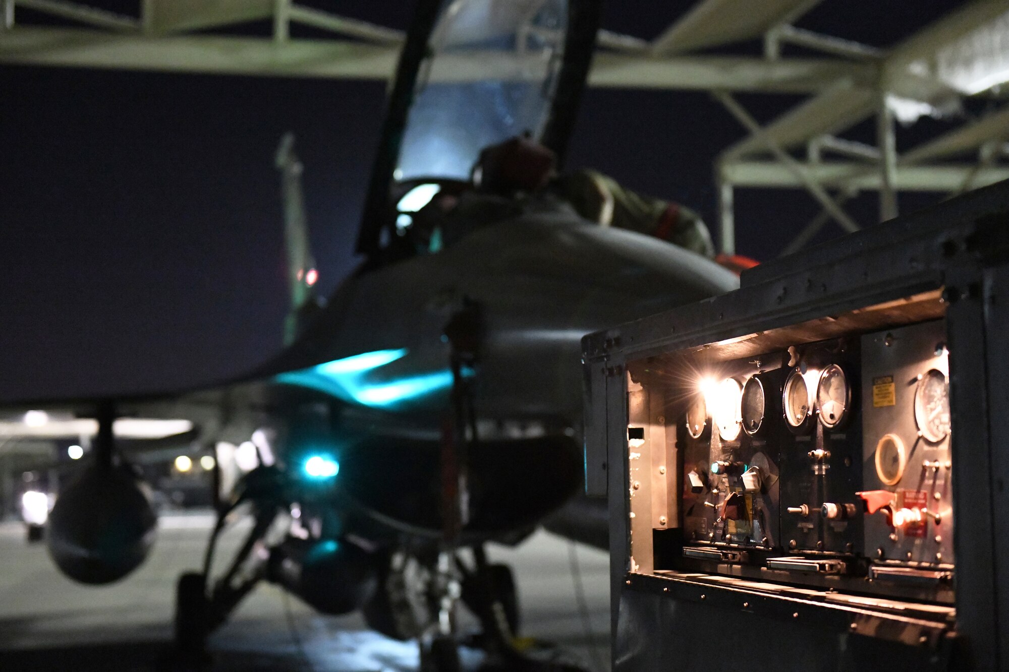 Airmen assigned to the 310th Aircraft Maintenance Unit perform maintenance on an F-16 Fighting Falcon, June 24, 2020, at Luke Air Force Base, Ariz.