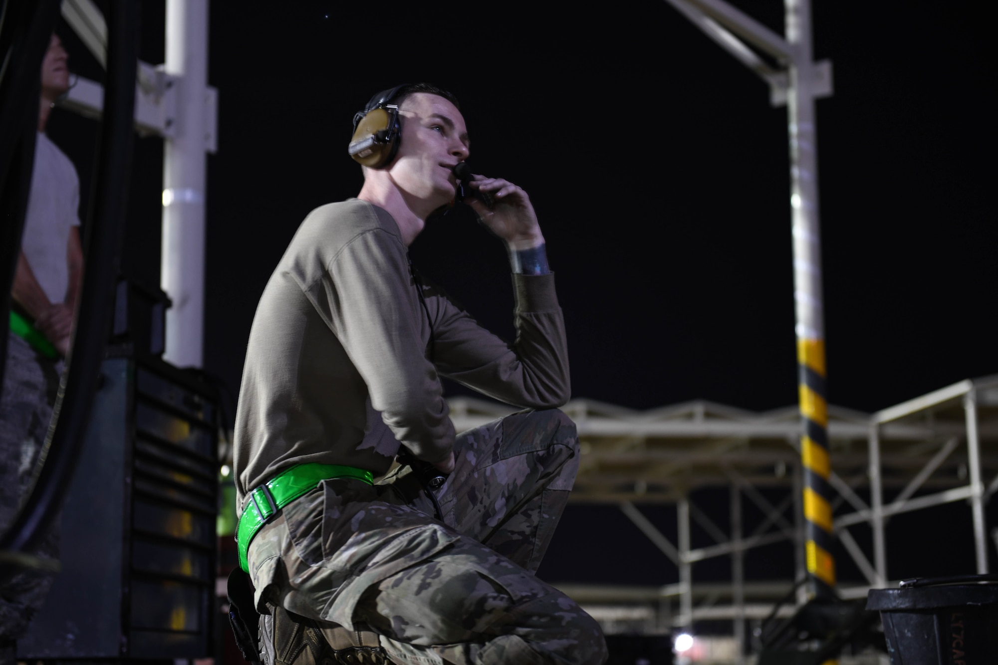 Senior Airman Robert Paul, 310th Aircraft Maintenance Unit engine technician, communicates with maintainers while performing a post-flight inspection on an F-16 Fighting Falcon, June 24, 2020, at Luke Air Force Base, Ariz.