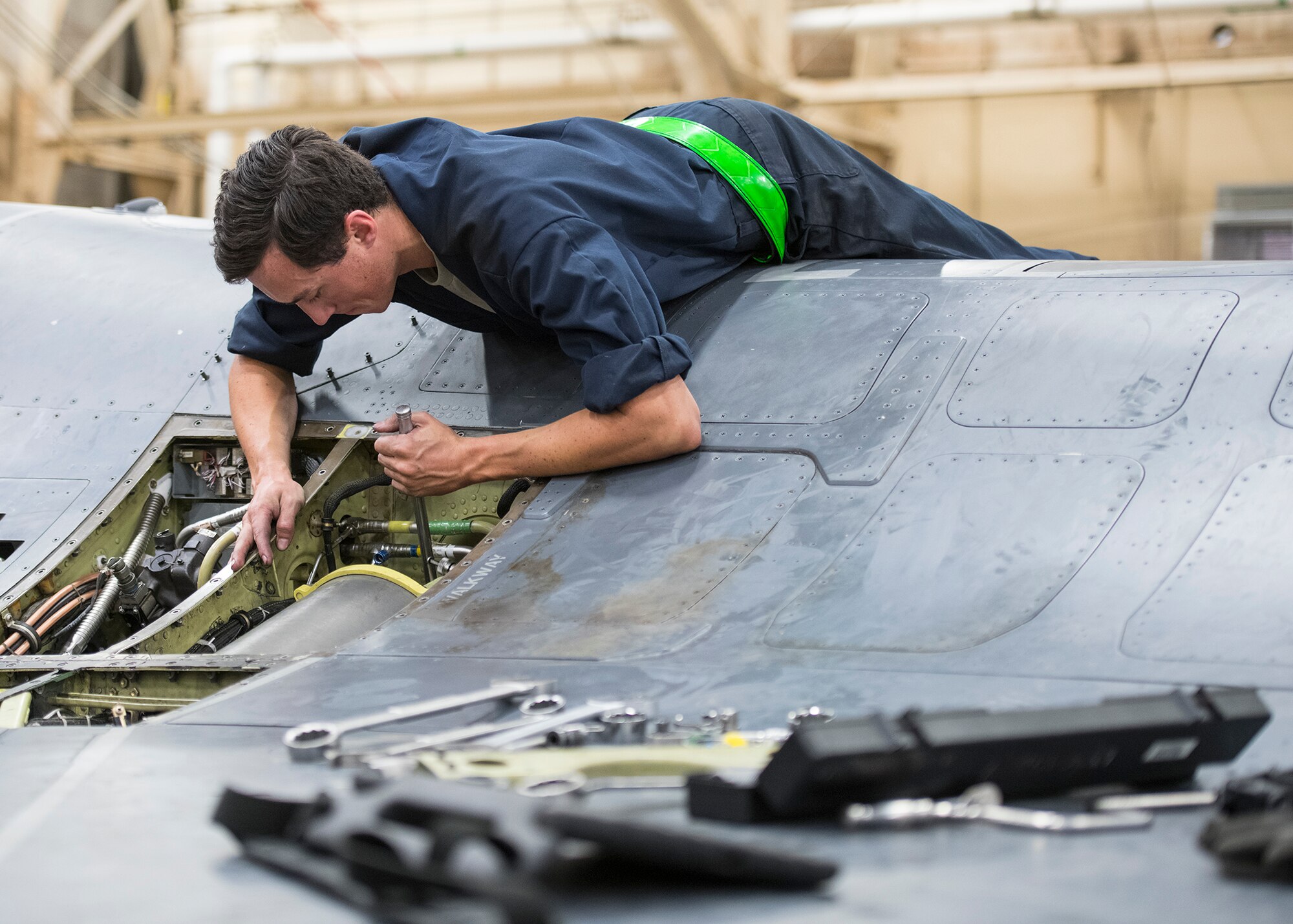 Airman 1st Class Jack Gearhart, 310th Aircraft Maintenance Unit dedicated crew chief, performs maintenance on an F-16D Fighting Falcon, June 24, 2020, at Luke Air Force Base, Ariz.