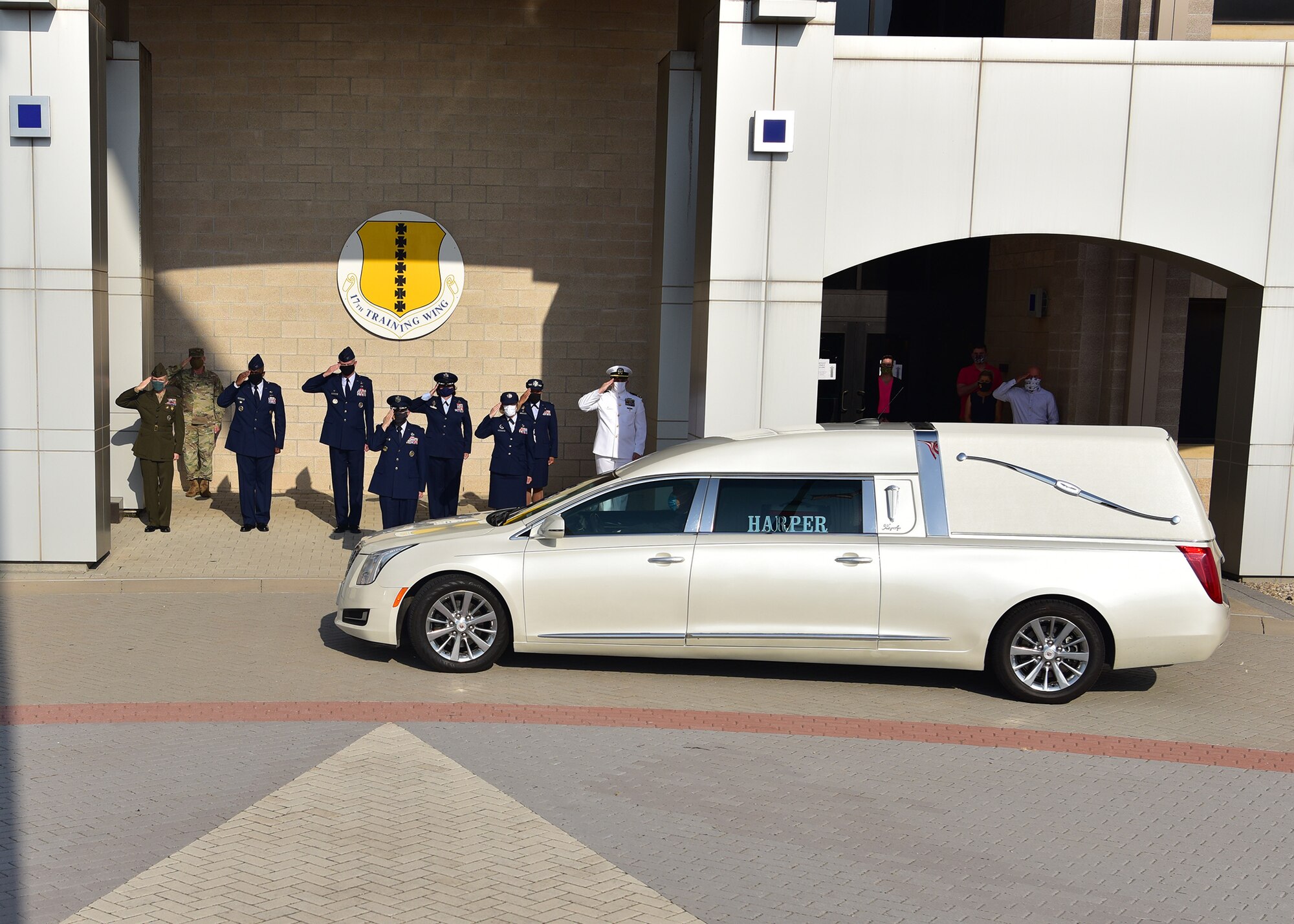 Goodfellow leadership pays respect as retired Col. Charles Powell’s casket leaves the Norma Brown building on Goodfellow Air Force Base, Texas July 8, 2020. Members from the different services came out to honor Powell for all he did at Goodfellow and San Angelo. (U.S. Air Force photo by Staff Sgt. Chad Warren)