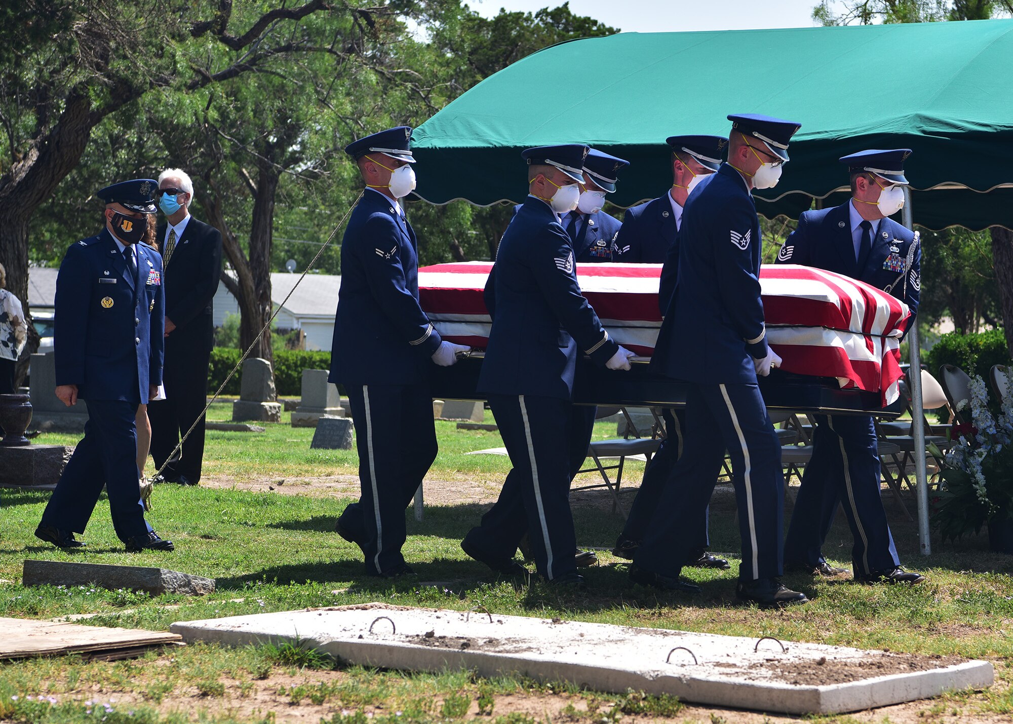 U.S. Air Force Col Andres Nazario, 17th Training Wing commander, follows behind honor guard members during retired Col. Charles Powell’s funeral at the Fairmont Cemetery, San Angelo Texas, July 8, 2020. Powell served as the Goodfellow commander from 1980 to 1984 and remained in the area until passing.(U.S. Air Force photo by Staff Sgt. Chad Warren)