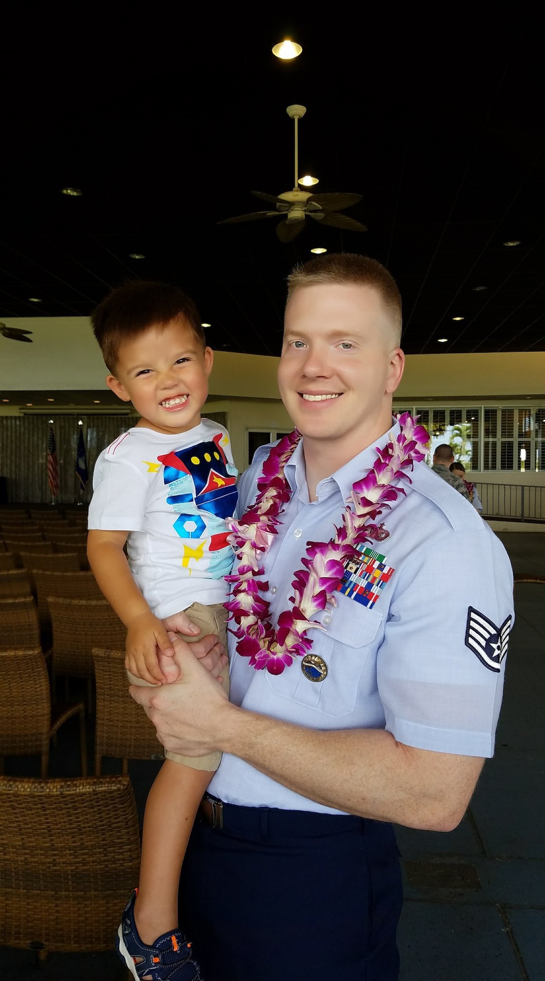 Tech. Sgt. Josef Margetiak, 614th Air Operations Center section chief, poses for a photo with his son at his Community College of the Air Force graduation. In late 2018, Margetiak was diagnosed with testicular seminoma cancer, and once cleared, he was diagnosed again in 2019. Throughout his fight with testicular cancer, Margetiak has been motivated by both his family and his goals to become a Physical Therapy to help others be the best versions of themselves, while pushing forward resiliently to complete his everyday duties. (Courtesy photo)