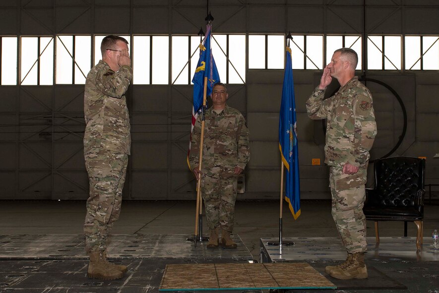 U.S. Air Force Col. William Fecke (right) renders a salute to Col. Shawn Anger, the 354th Fighter Wing commander, upon relinquishing command of the 354th Medical Group (MDG) during a change of command ceremony at Eielson Air Force Base, Alaska, July 8, 2020.