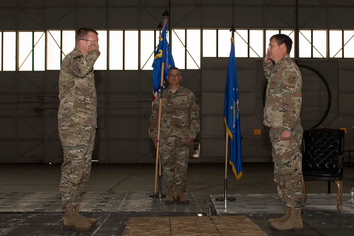 U.S. Air Force Col. William Thoms (right) renders a salute to Col. Shawn Anger, the 354th Fighter Wing commander, upon assuming command of the 354th Medical Group (MDG) during a change of command ceremony at Eielson Air Force Base, Alaska, July 8, 2020.