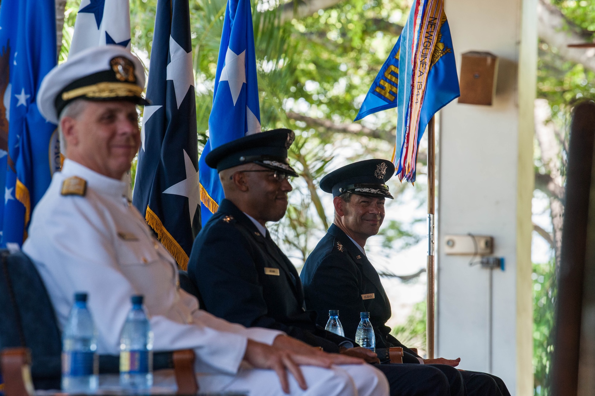 Gen. Kenneth S. Wilsbach (right), Gen. CQ Brown, Jr., and Adm. Philip Davidson, Commander of U.S. Indo-Pacific Command listen as Gen. David L. Goldfein, Chief of Staff of the Air Force, gives his remarks during the Pacific Air Forces’ Change of Command Ceremony on Joint Base Pearl Harbor-Hickam, Hawaii, July 8, 2020. PACAF’s area of responsibility is home to 60 percent of the world’s population in 36 nations spread across 53 percent of the Earth’s surface and 16 time zones, with more than 1,000 spoken languages. (U.S. Air Force photo by Staff Sgt. Hailey Haux)