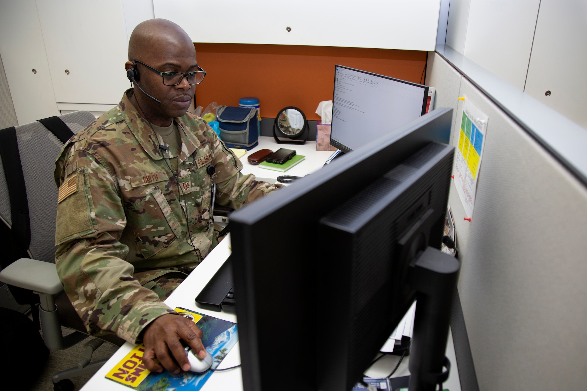 Tech. Sgt. Clayton Smith, a medical resources noncommissioned officer assigned to the Office of the Joint Surgeon at the National Guard Bureau, participates in a phone conference at the Herbert R. Temple Jr. Army National Guard Readiness Center, Arlington Hall Station, Arlington, Va., March 2, 2020. Smith came to the U.S. from Trinidad and Tobago at the age of 26 and enlisted in the Air National Guard to gain real world experience, earning U.S. citizenship along the way.