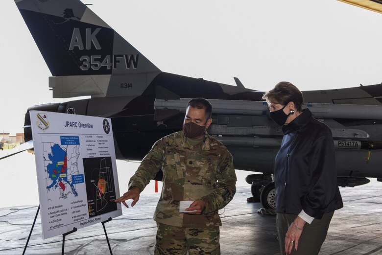 U.S. Air Force Lt. Col. Russell Reese, the 354th Range Squadron commander, briefs Secretary of the Air Force Barbara M. Barrett on the Joint Pacific Alaska Range Complex (JPARC) during her visit to Eielson Air Force Base, Alaska, July 7, 2020. Reese briefed Barrett on the 354th Range Squadron's mission which is dedicated to modernizing the JPARC infrastructure to provide necessary training aids to hone warfighter skills. (U.S. Air Force photo by Airman 1st Class Aaron Larue Guerrisky)