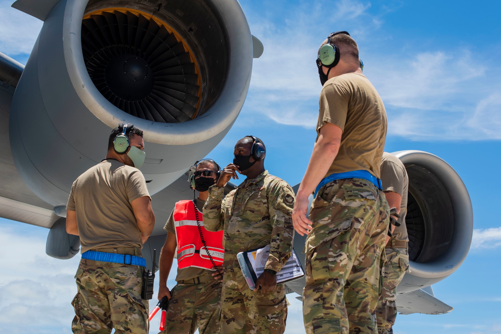 A C-17 Globemaster assigned to the 154th Wing, Hawaii Air National Guard, prepares to receive a post-flight evaluation from Airmen assigned to the 734th Air Mobility Squadron after a Joint Forcible Entry Operation (JFEO) jump at Andersen Air Force Base, Guam, June 30.