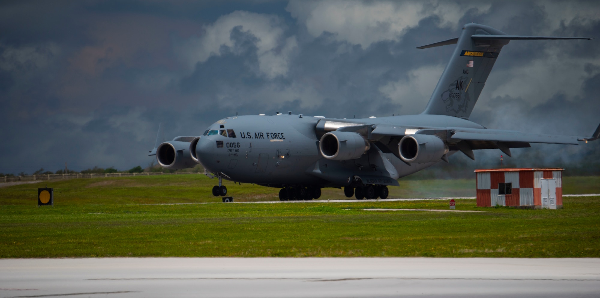 A C-17 Globemaster III assigned to the 144th Airlift Squadron, Anchorage, Alaska Air National Guard, lands after a Joint Forcible Entry Operation (JFEO) jump into Andersen Air Force Base, Guam, June 30.